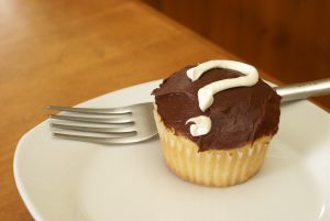 cupcake with a question mark in the frosting